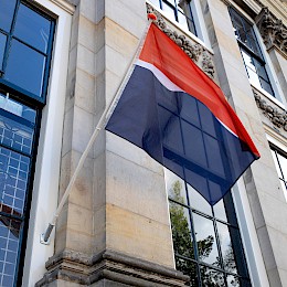 Waving the Future, photography of a flag on the facade of Upstream Gallery